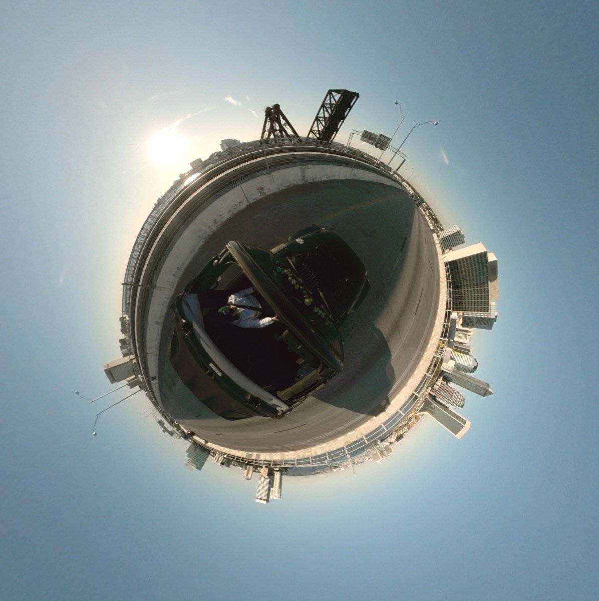 Tiny planet photo of a Jeep