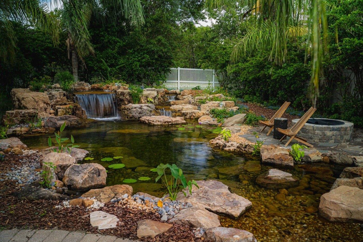 Backyard pond landscaping after